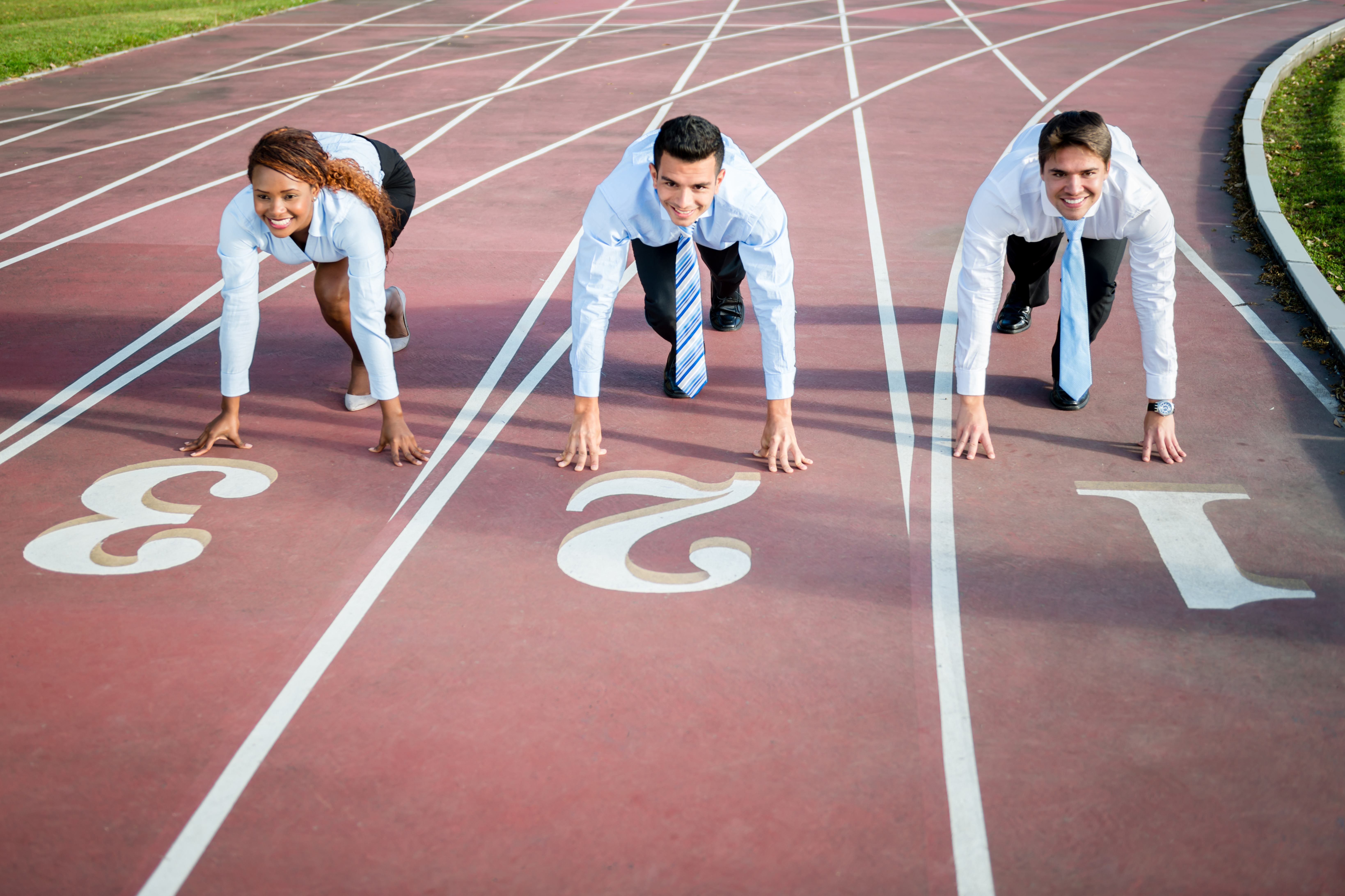Group of competitive business people racing