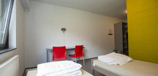 Hierop zien jullie onze kamers en eetzaal te Genk