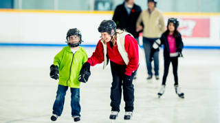 Ice skating at an indoor skating rink