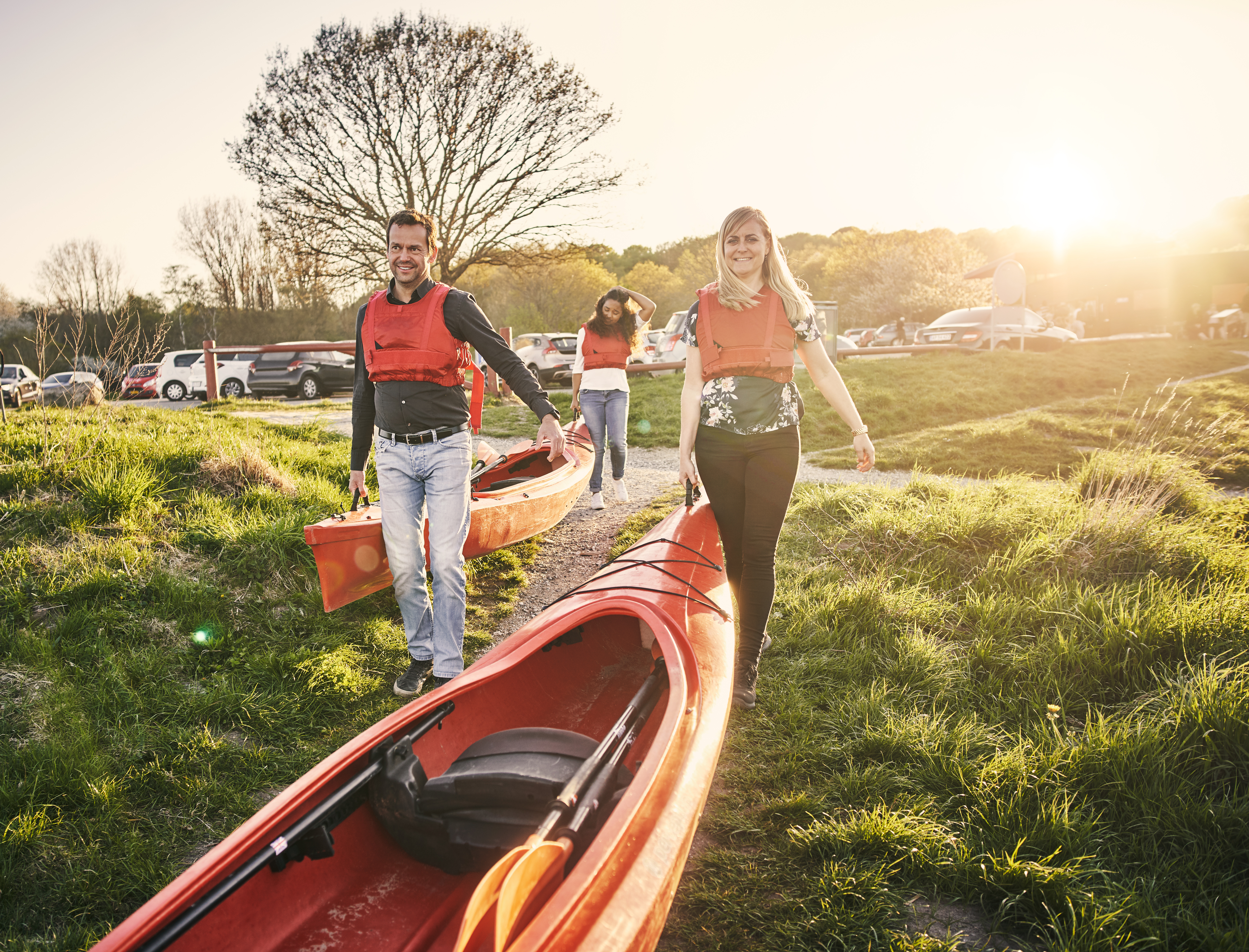 Cropped shot of a group of diverse colleagues canoeing as part of their company's team building retreat